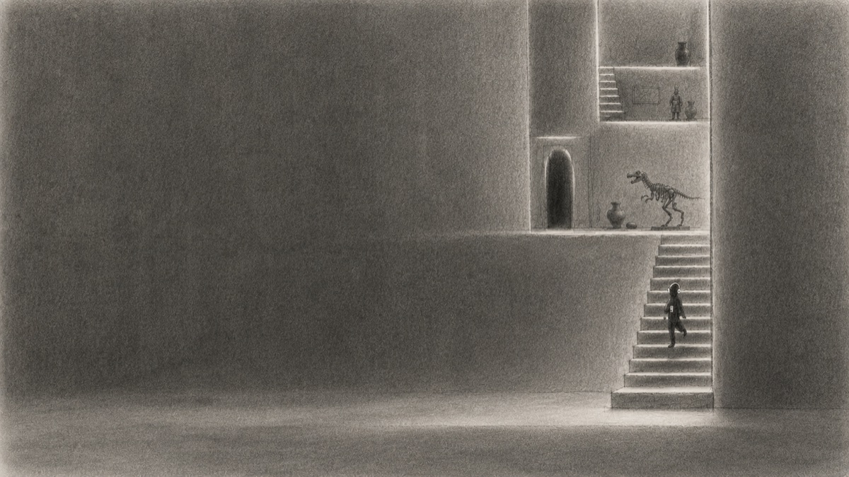 A visitor listening to a narration in a gallery